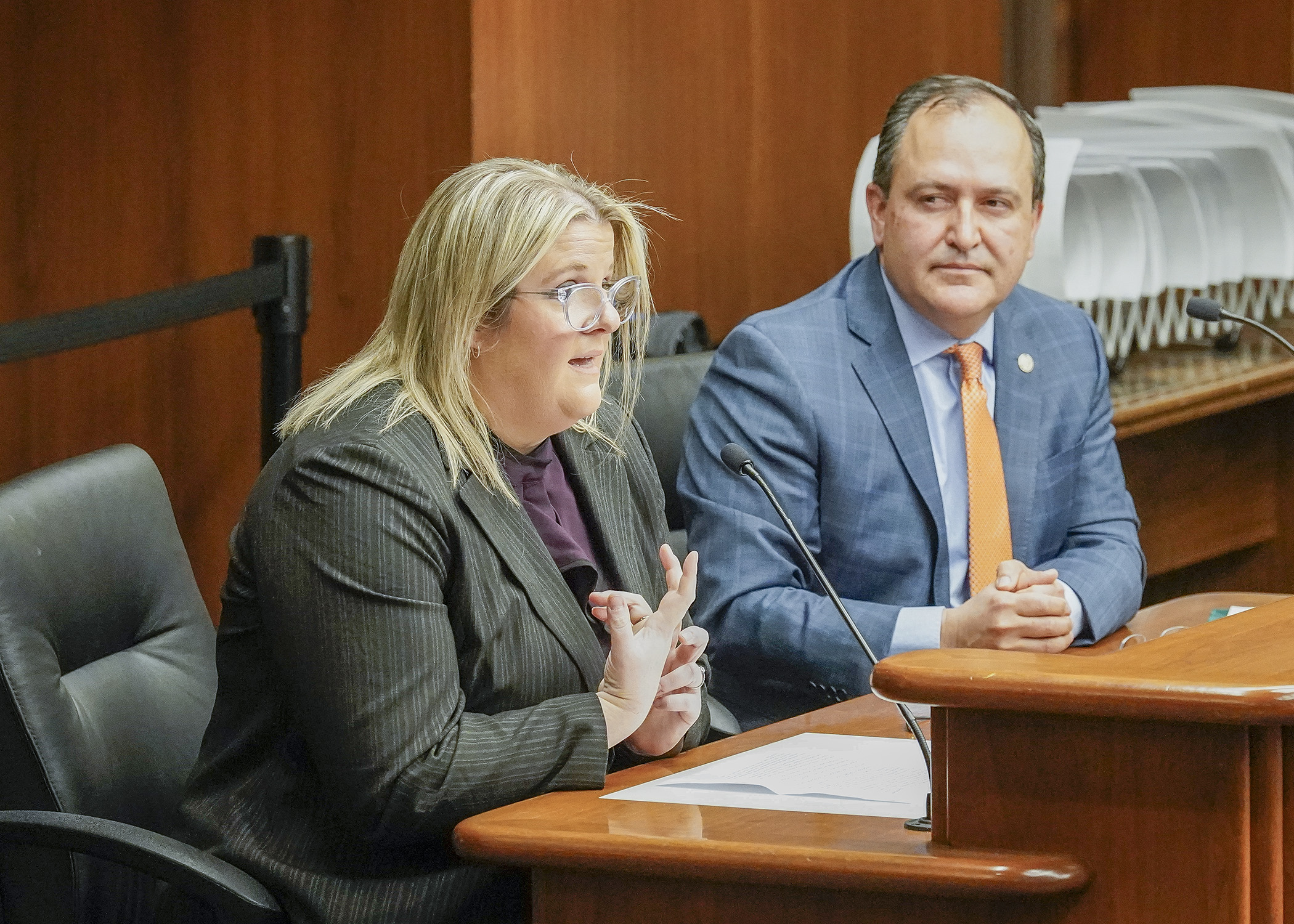 Bloomington Police Officer Angela Borchardt testifies before the House Public Safety Finance and Policy Committee Jan. 26 in support of HF506, sponsored by Rep. Jon Koznick, right. (Photo by Andrew VonBank)